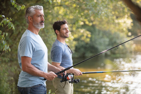 portrait of two men fishing