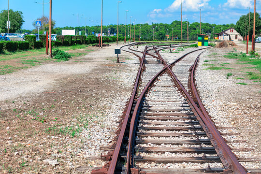 Railway tracks in a rural area on a sunny summer day