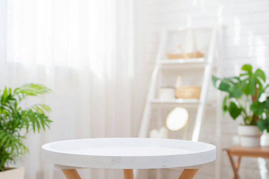 Closeup of round empty table in blurred spa room with curtained window