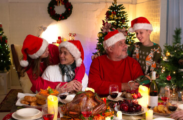 A happy family holds a Christmas party at home.