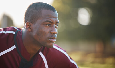 Face, focus and black man in sports training, rugby competition or game on field for power or challenge. Side profile, thinking and tired athlete or person with workout, exercise or fitness strategy