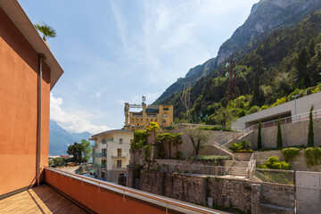 Fototapeta na wymiar View of Lake Garda from a balcony with wooden floor
