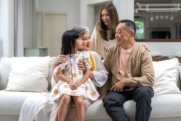 Portrait of happy love family asian mother playing with adorable asian kid girl.daughter, care, insurance.Happy family moments good time love with grandparents.Love of big family