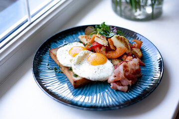 Breakfast Plate with Fried Eggs and Bacon