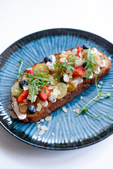 Sweet Panini with Strawberries and Grapes on White Background