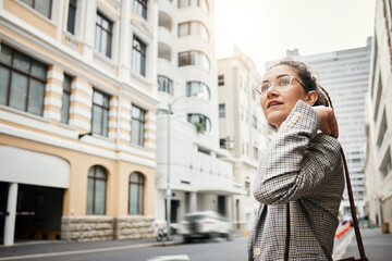 Fototapeta premium Business woman in city, travel and commute to work with buildings, motion blur and waiting for taxi cab. Corporate female person in urban street, professional clothes and journey to workplace