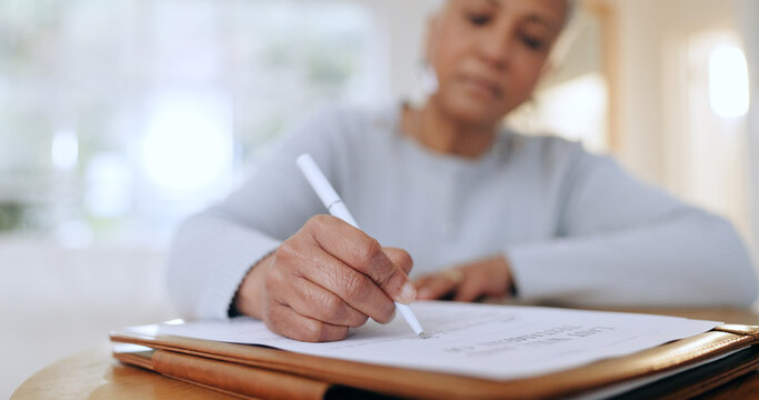 Senior woman, sign and writing with documents, paperwork and application for life insurance policy. Person, hand and checklist for compliance, investment or will in retirement with signature in home
