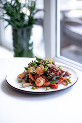 salad with shrimps on the white 