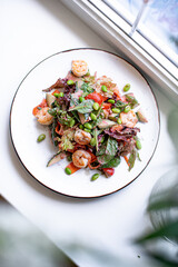 salad with shrimps on the white 