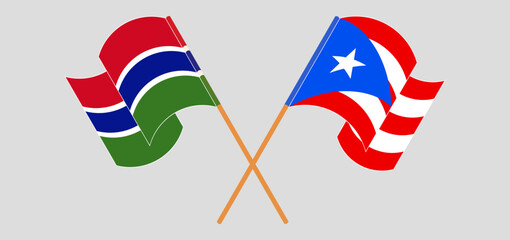 Crossed and waving flags of the Gambia and Puerto Rico