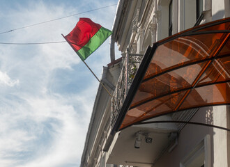 National flag of Belarus on the facade of the building in Minsk