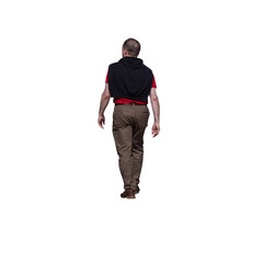 Naklejka premium Homme adulte marchant au printemps, vu de dos, polo rouge, pantalon beige et pull noir noué sur les épaules