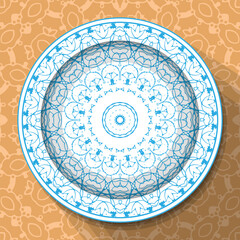 A white plate with an openwork blue ornament, located on a light brown patterned tablecloth. Pattern No. 4. Vector illustration
