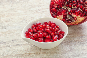 Ripe red Pomegranate seeds in the bowl