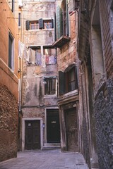 Narrow alleyway with old buildings in Venice, Italy
