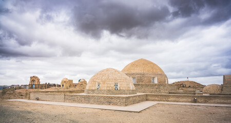 Ancient Muslim cemetery Mizdakhan with a centuries-old history on a hill in Uzbekistan with mausoleums and burials