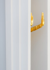 Close-up photo of golden Buddha's hand