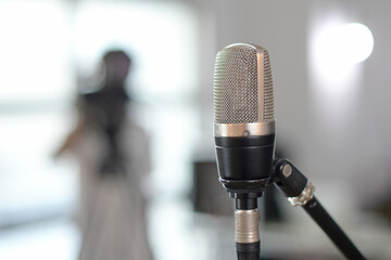 Close-up photo of microphone in recording studio