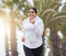 Running, happy and woman outdoor training for a runner marathon, exercise and fitness. Sport wellness, run workout and healthy sports cardio of plus size athlete happiness from India in the morning