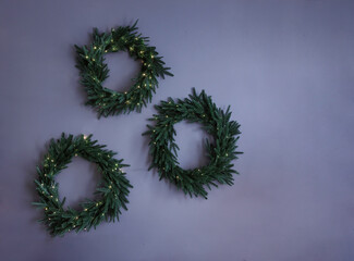 Set collection of green creative stylish rural christmas wreath on wall on grey blue background, mockup, copy text, greeting card, background with place for text