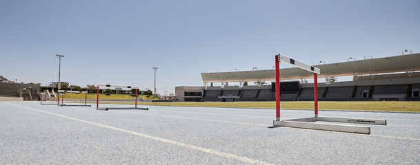 Stadium, hurdles and sports event for exercise, olympics and training with no people, space and...