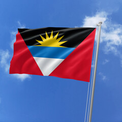 Antigua and Barbuda flag fluttering in the wind on sky.