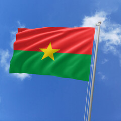 Burkina Faso flag fluttering in the wind on sky.