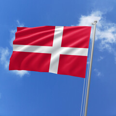Denmark flag fluttering in the wind on sky.