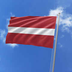 Latvia flag fluttering in the wind on sky.