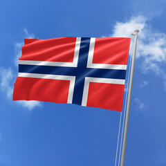 Norway flag fluttering in the wind on sky.