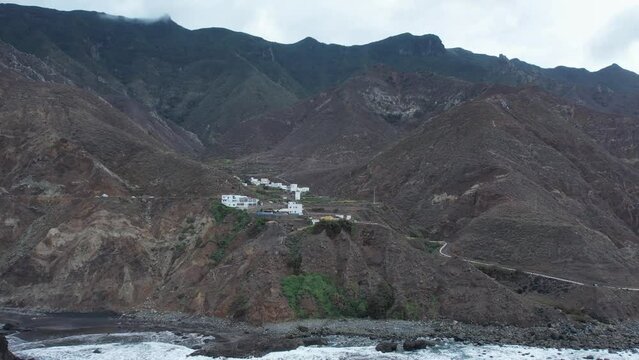 Aerial view of dramatic Atlantic Ocean coastline of Anaga, steep cliffs and small villages, Canary Islands, Spain