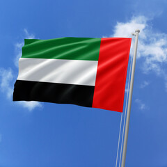 United Arab Emirates flag fluttering in the wind on sky.