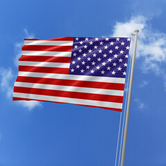 United States flag fluttering in the wind on sky.
