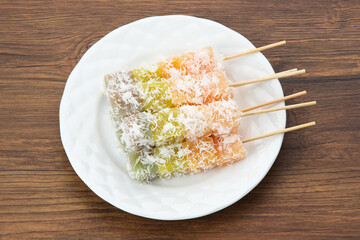 Sentiling or ongol-ongol, Indonesian traditional snack, made from cassava sprinkled with grated coconut
