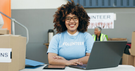 Volunteer woman, laptop and portrait at clothes drive with smile, community service and kindness at...