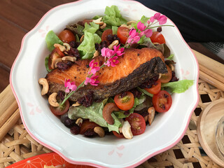 Dish of yummy Salmon salad décor with Chain of love flowers. 