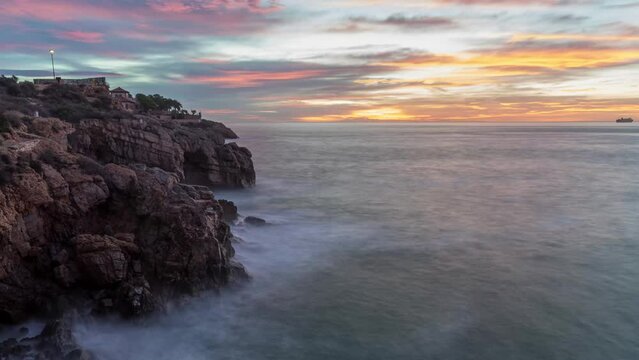 Long exposure Timelapse of sunrise from Forti de la Reina, Tarragona with awesome colours in the clouds and sky