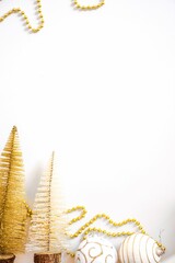 Closeup of golden Christmas tree decorations - obrazy, fototapety, plakaty