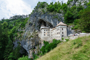 Fototapeta na wymiar Predjama, Slovenia - June 27, 20203: Predjama Castle in Slovenia, Europe. Renaissance castle built within a cave mouth in south central Slovenia.