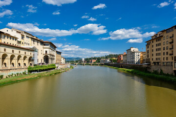 Fototapeta na wymiar Florence, Italy - June 28, 2023: Florence, Italy on the Arno River. View of Ponte Vecchio bridge.