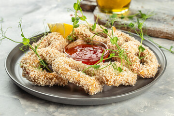 fried squid rings breaded with lemon. Food recipe background. Close up