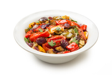 Mediterranean roasted vegetables in a salad bowl isolated on white background. - 671477858