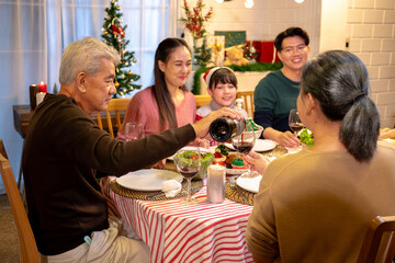 Happy people are celebrating on a table meal when christmas and new year at home.