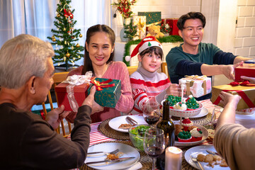 Happy people are celebrating on a table meal when christmas and new year at home.