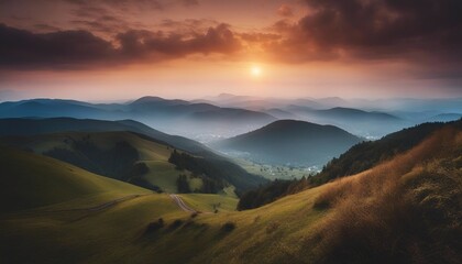 view of misty mountain layers and sunset from a high hill