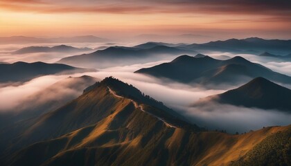 Fototapeta premium view of misty mountain layers and sunset from a high hill