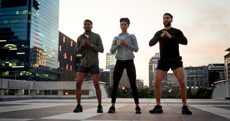 People, fitness and outdoor in city, workout and evening for exercise, group and strong. Training, cardio or sportswear for athlete, town or sports strength, men or woman for active, squat or muscle