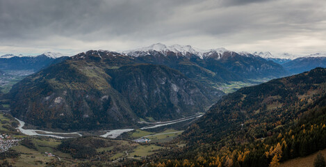 mountain landscape with the Rhine river in the Swiss Alps in late autumn