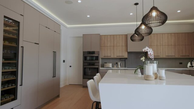 Elements of Modern Luxurious Kitchen Interior Design in a newly renovated house, move camera wide footage