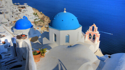 beautiful view of the blue dome of Oia in Santorini (Greece) - 671490418